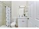 Bathroom boasts a shower, a white vanity and a contemporary style at 19182 Seaview St, Orlando, FL 32833