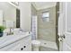 Well-lit bathroom features a marble vanity and walk-in shower with stone tile at 19182 Seaview St, Orlando, FL 32833