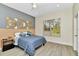 Bright bedroom with a large window, ceiling fan, and modern decor creates a relaxing space at 19182 Seaview St, Orlando, FL 32833