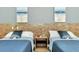 Comfortable bedroom features two beds and simple, elegant decor at 19182 Seaview St, Orlando, FL 32833