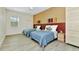 This well-lit bedroom offers two twin beds and sleek wood-look floors at 19182 Seaview St, Orlando, FL 32833
