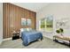 Cozy bedroom with wood accent wall, and a window with lots of natural light at 19182 Seaview St, Orlando, FL 32833