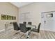 Bright dining room features a glass top table, modern chairs and light tile flooring at 19182 Seaview St, Orlando, FL 32833