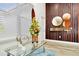 Elegant entryway with a glass table, stylish accessories, and wood slat wall decor at 19182 Seaview St, Orlando, FL 32833