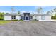 Charming single-story home with gray paint, new roof, and a well-manicured gravel yard at 19182 Seaview St, Orlando, FL 32833