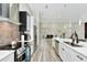 Bright kitchen with stainless steel appliances and a view of the dining area at 19182 Seaview St, Orlando, FL 32833