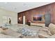This open concept living room with sleek flooring and a custom wood accent wall at 19182 Seaview St, Orlando, FL 32833