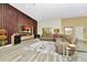 Bright living room featuring wood floors, a modern entertainment center, and neutral toned sectional at 19182 Seaview St, Orlando, FL 32833