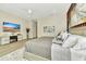 This is a stylish main bedroom with modern decor and a TV entertainment center at 19182 Seaview St, Orlando, FL 32833