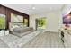 An appealing main bedroom boasts hardwood floors and a sliding glass door for an abundance of natural light at 19182 Seaview St, Orlando, FL 32833