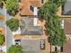 Birds-eye view of home featuring mature trees and a residential neighborhood at 207 Vervain Ave, Davenport, FL 33837