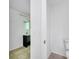 Bathroom features white walls, neutral tile flooring and vanity with sink at 207 Vervain Ave, Davenport, FL 33837