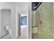 Bathroom featuring spacious walk-in shower with shower head and toilet at 207 Vervain Ave, Davenport, FL 33837