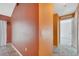Hallway featuring neutral wall color and tile flooring leading to various rooms at 207 Vervain Ave, Davenport, FL 33837