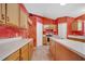 Kitchen features tiled floor, ample cabinets, and modern appliances at 207 Vervain Ave, Davenport, FL 33837
