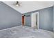 Open living room featuring neutral wall color and lots of natural light at 207 Vervain Ave, Davenport, FL 33837