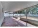 Covered patio with a view of the backyard, offering an outdoor living space at 207 Vervain Ave, Davenport, FL 33837