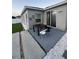 Backyard featuring a dark table, white rock, and turf grass at 209 Citrus Pointe Dr, Haines City, FL 33844