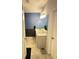 Bright bathroom featuring double sinks, white cabinets, a large mirror, and tile floors at 209 Citrus Pointe Dr, Haines City, FL 33844