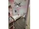 Small bedroom with gray walls, wood-look flooring, a twin bed, decor lighting, and accent pillows at 209 Citrus Pointe Dr, Haines City, FL 33844