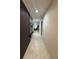Bright hallway with decorative wall accents and recessed lighting at 209 Citrus Pointe Dr, Haines City, FL 33844