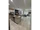 Open kitchen with granite countertops, island, stainless steel appliances, and tile flooring at 209 Citrus Pointe Dr, Haines City, FL 33844