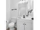 Bathroom with white vanity, modern fixtures, and a matching toilet at 227 Sand Ridge Drive, Davenport, FL 33896
