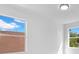 This bedroom has carpet flooring and two windows at 227 Sand Ridge Drive, Davenport, FL 33896