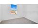 A closet with carpet and white shelving at 227 Sand Ridge Drive, Davenport, FL 33896