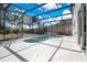 Backyard screened-in pool with a view at 227 Sand Ridge Drive, Davenport, FL 33896