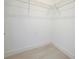 Empty walk-in closet with minimalist design at 2437 Sw 147Th Ln, Ocala, FL 34473