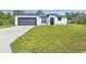 Well-maintained, modern home with a spacious front yard and attached garage at 2437 Sw 147Th Ln, Ocala, FL 34473