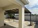 Covered back patio view, showing a column feature and the landscaped yard at 2439 White Lilly Dr, Kissimmee, FL 34747