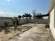 Spacious backyard featuring a covered patio, privacy fence, and some landscaping at 2439 White Lilly Dr, Kissimmee, FL 34747