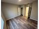 Bedroom with wood-look floors. Walk in closet and bathroom entrance shown at 2439 White Lilly Dr, Kissimmee, FL 34747