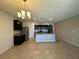 Open kitchen with stainless steel appliances and dark cabinetry at 2439 White Lilly Dr, Kissimmee, FL 34747