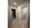 Functional laundry room featuring a washer and dryer and neutral tile flooring at 2439 White Lilly Dr, Kissimmee, FL 34747
