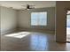 Inviting living room with tile flooring, ceiling fan and backyard access at 2439 White Lilly Dr, Kissimmee, FL 34747