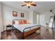 Comfortable bedroom featuring dark wood flooring and neutral walls, creating a calming and inviting atmosphere at 253 Granada Blvd, Davenport, FL 33837