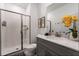 Clean bathroom with a glass-enclosed shower, sleek vanity, and stylish decor at 2605 Reading Trl, Kissimmee, FL 34746