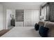 Well-lit bedroom featuring a decorative mirror, closet, and ensuite bathroom at 2605 Reading Trl, Kissimmee, FL 34746
