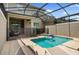 Inviting private pool area with lounge chairs, patio seating, and a -safe fence at 2605 Reading Trl, Kissimmee, FL 34746