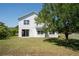 Wide angle of large backyard with a large shady tree at 2764 Patrician Cir, Kissimmee, FL 34746
