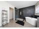 Stylish bathroom with a glass-enclosed shower, freestanding tub, and modern tile accents at 2764 Patrician Cir, Kissimmee, FL 34746