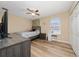 Comfortable bedroom featuring hardwood floors, a ceiling fan, and closet at 2764 Patrician Cir, Kissimmee, FL 34746