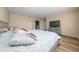 Spacious bedroom with gray-toned furniture, ceiling fan, and a view of interior hallway at 2764 Patrician Cir, Kissimmee, FL 34746