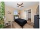 Bedroom showcasing ceiling fan, closet, mirror vanity, and view into closet and adjacent room at 2764 Patrician Cir, Kissimmee, FL 34746
