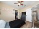 Bedroom featuring walk-in closet, ceiling fan, and a view of the home interior at 2764 Patrician Cir, Kissimmee, FL 34746