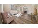 Open-concept living room with light wood flooring, plush seating, and elegant decor at 2764 Patrician Cir, Kissimmee, FL 34746