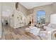 Bright living room with high ceilings, modern decor, light wood floors, and an arched window at 2764 Patrician Cir, Kissimmee, FL 34746